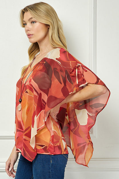 Cold Shoulder V-Neck Hanky Hem Poncho Top in Ivory/Marigold/Orange